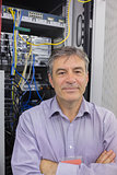 Technician standing in front of servers