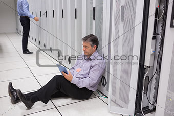 Man checking the data store with the tablet pc