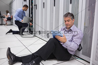 Various technicians working on servers