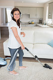 Woman cleaning wearing headphones