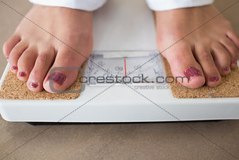 Feet standing at the scale