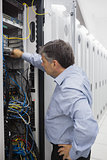 Technician working on a case of server racks