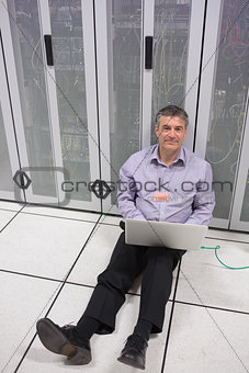 Technician checking the servers on the floor