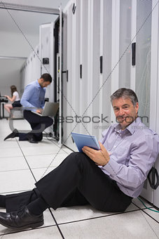 Technician working on the floor with tablet pc