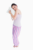 Standing woman relaxing on her comfortable pillow