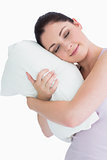 Smiling woman sleeping on pillow