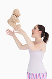 Woman throwing her teddy bear