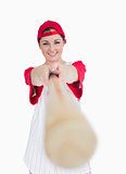 Smiling woman holding out baseball bat