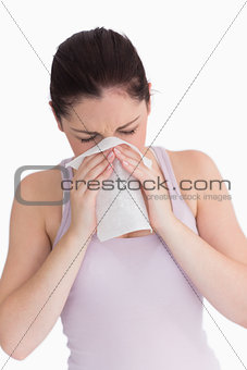 Woman blowing her nose