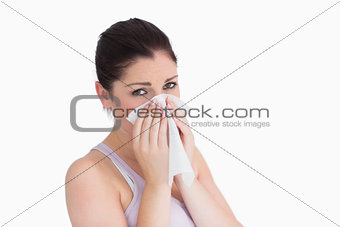 Sad woman blowing her nose