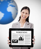 Businesswoman holding digital tablet showing world news