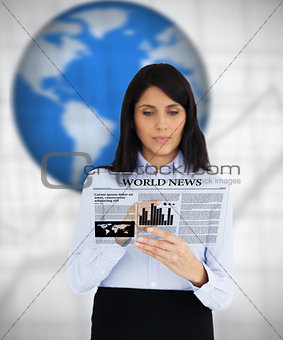 Businesswoman reading virtual newspaper