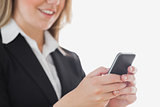 Closeup of business woman using cell phone