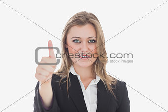 Business woman gesturing thumbs up
