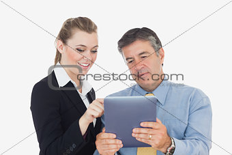 Business people using tablet together
