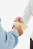 Businessman handing over bribe to coworker