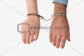 Hands of business people in handcuffs