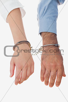Closeup of handcuffed business people
