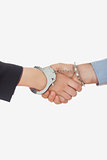 Closeup of handcuffed handshake