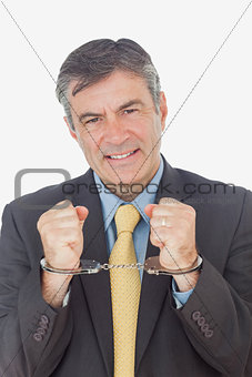 Businessman with handcuffed hands