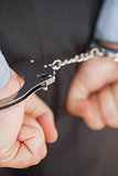 Closeup of businessman with handcuffs