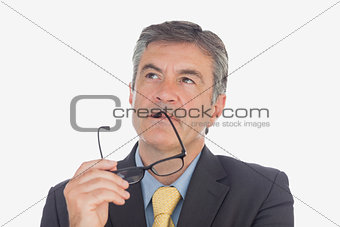 Businessman with glasses looking up