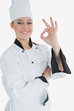 Happy female chef gesturing ok sign
