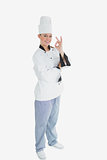 Portrait of female chef gesturing ok sign