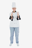 Female chef gesturing thumbs up sign