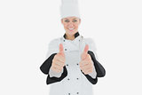 Happy female chef gesturing thumbs up