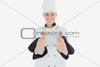 Happy female chef gesturing thumbs up