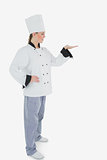 Female chef looking at invisible product
