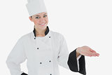 Female chef displaying invisible product