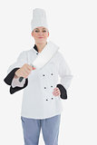 Portrait of female chef with meat cleaver