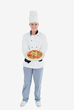 Female chef offering pizza