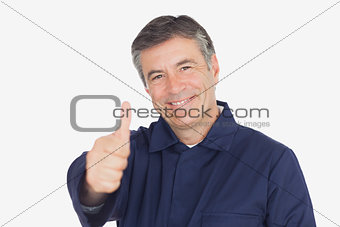 Mechanic showing thumbs up sign