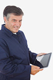 Happy mechanic holding digital tablet