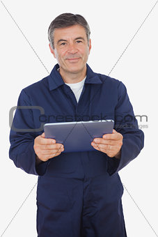 Mature mechanic using digital tablet