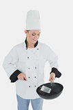 Chef using spatula and frying pan
