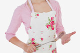 Woman in apron holding spatula