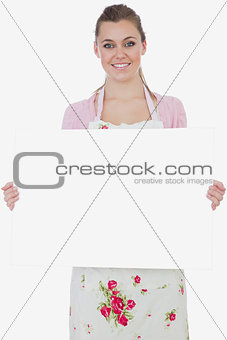 Maid holding blank billboard
