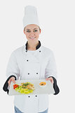 Female chef with healthy meal