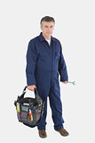 Portrait of mechanic carrying tool bag