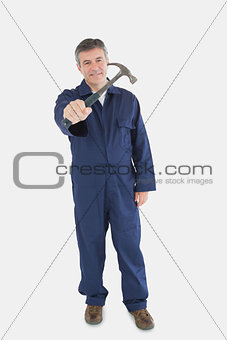 Male technician holding hammer