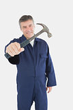 Male technician with hammer
