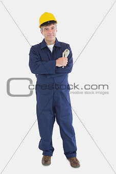 Mechanic with hardhat holding vise grip