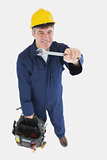 Technician with wrench carrying tool bag