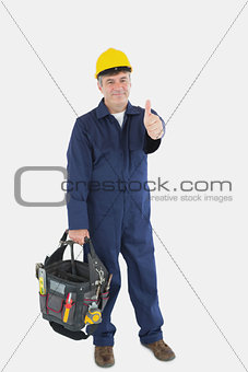 Mechanic with tool bag showing thumbs up sign