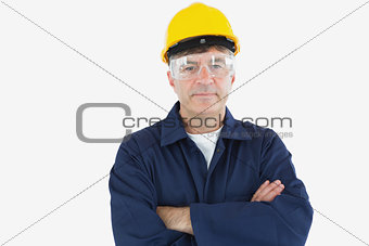 Confident technician with arms crossed