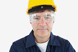 Technician wearing protective glasses and hardhard